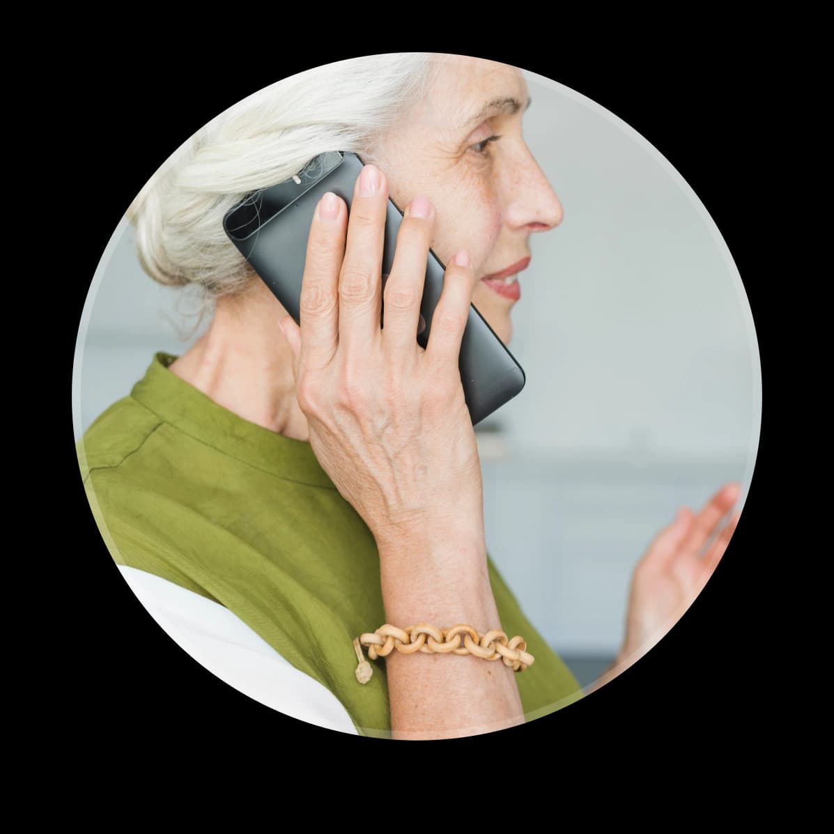 Chronic care patient receiving remote support through a phone call at home.