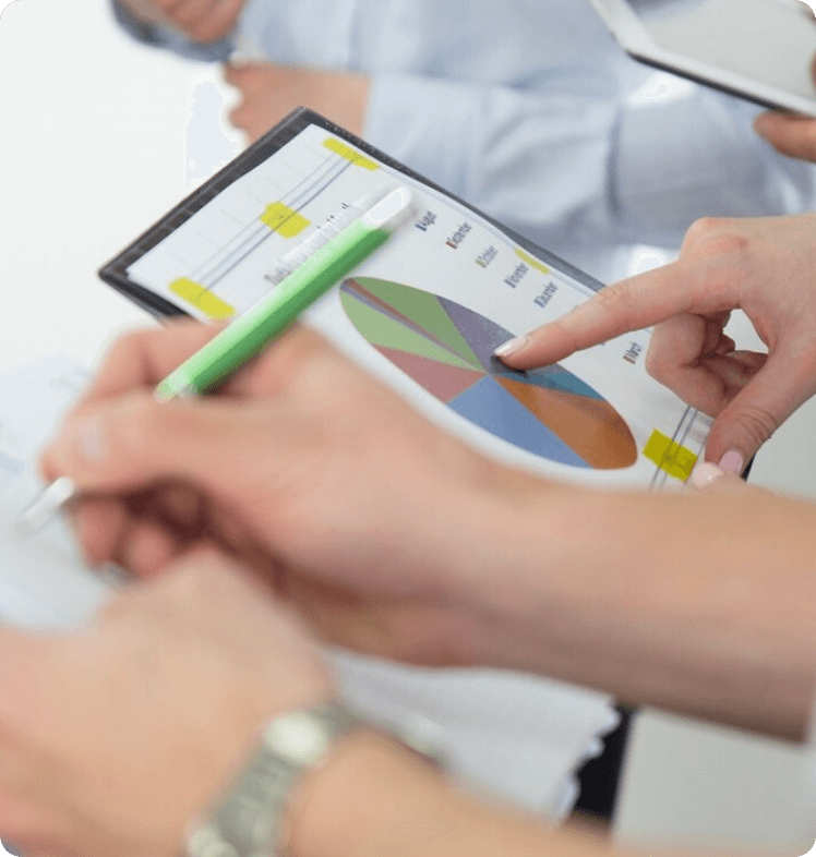 Team analyzing chart data