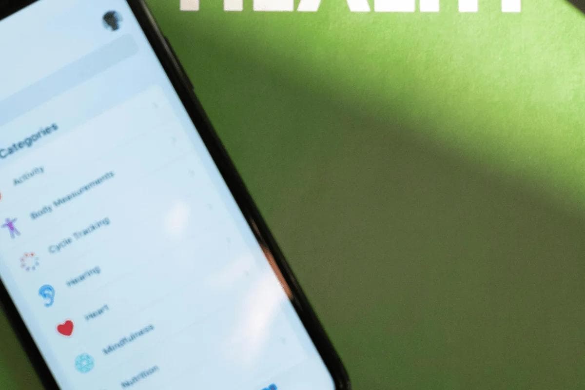 Smartphone displaying health tracking app categories.