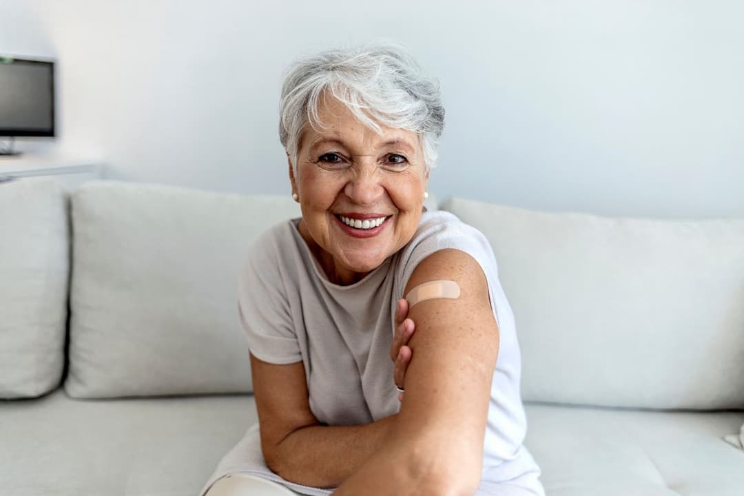 Happy patient with connected care reminders for flu shot
