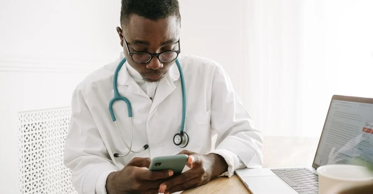 Doctor reviewing patient data on tablet for chronic care management eligibility assessment